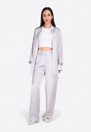 Model wearing EMIRATES LIMITED Printed White Pants – front view, East Vibe